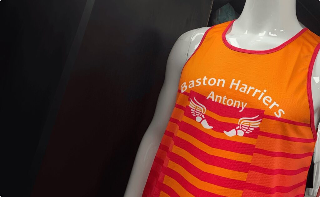 mannequin with an orange vest on